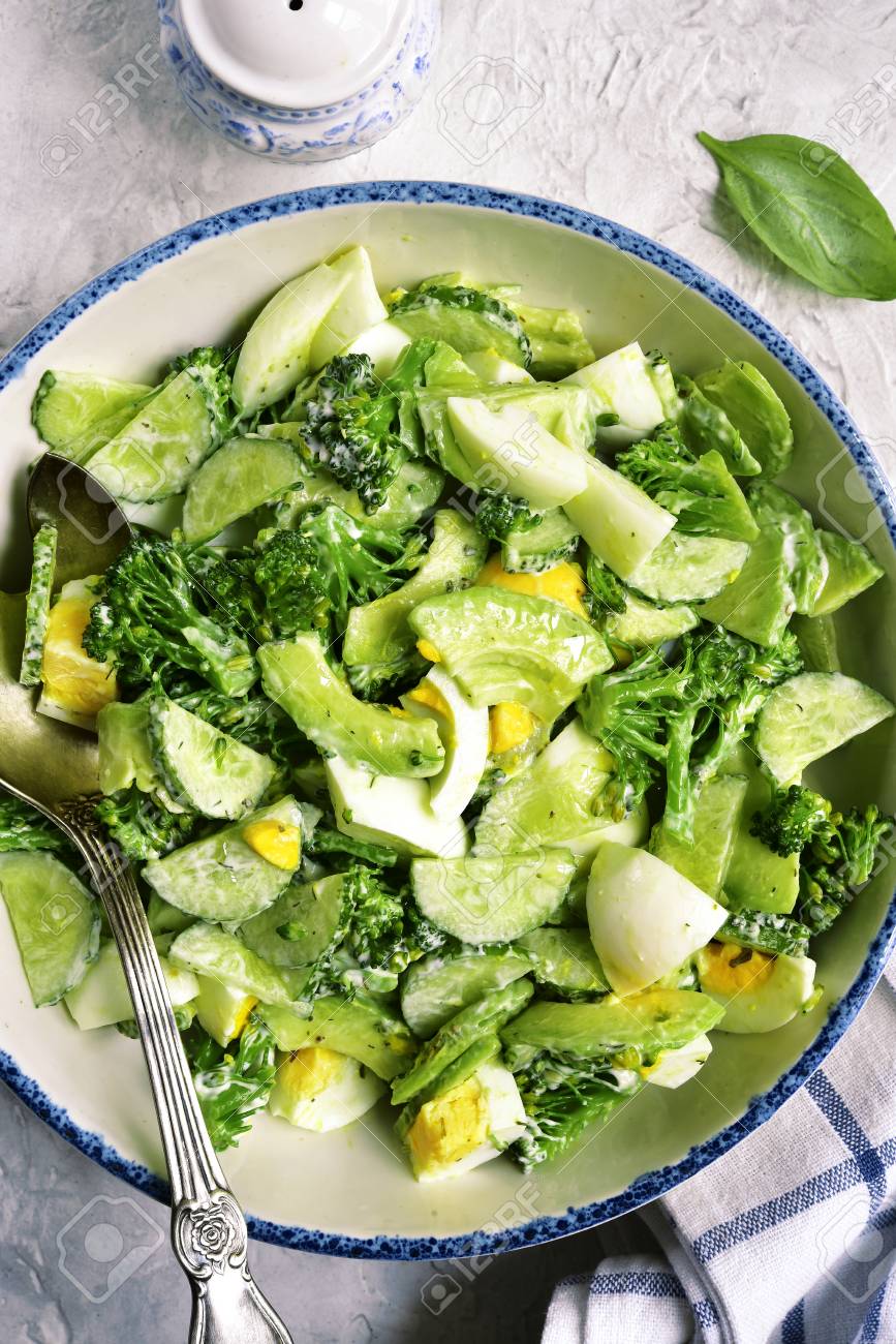 Avocado salad with broccoli,cucumber and boiled eggs.Top view. | Feel ...